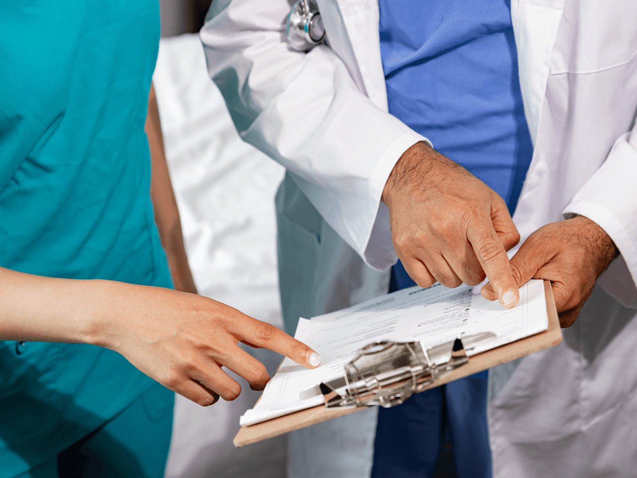 Doctor and nurse checking medical report