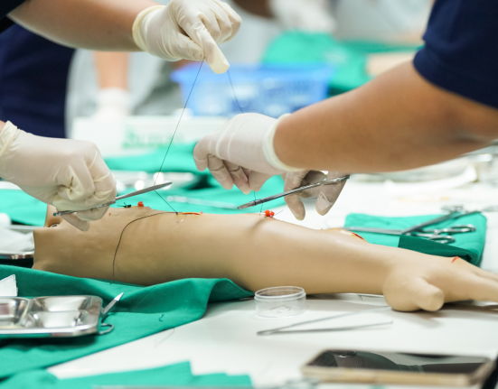 Nursing Students Practicing Surgical Suturing.