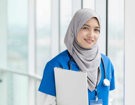 portrait of female nurse holding a medical record