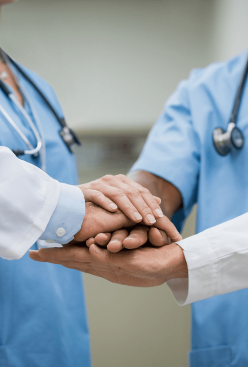 doctors and young nurses stacking hands together
